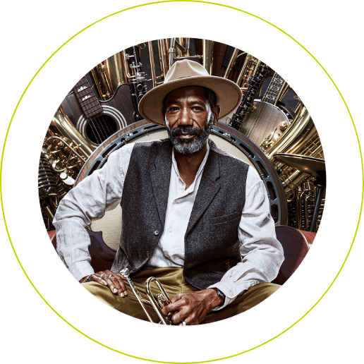 Confidently seated on a throne of various musical instruments, an elderly man holds a trumpet